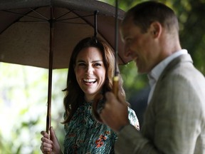 FILE - In this Wednesday, Aug. 30, 2017 file photo Britain's Prince William and his wife Kate, Duchess of Cambridge smile as they walk through the memorial garden in Kensington Palace, London. Kensington Palace says Prince William and his wife, the Duchess of Cambridge, are expecting their third child. The announcement released in a statement Monday Sept. 4, 2017 says the queen is delighted by the news. (AP Photo/Kirsty Wigglesworth, File)