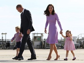 FILE - In this Friday, July 21, 2017 file photo Britain's Prince William, second left, and his wife Kate, the Duchess of Cambridge, second right, and their children, Prince George, left, and Princess Charlotte, right are on their way to board a plane in Hamburg, Germany. Kensington Palace says Prince William and his wife, the Duchess of Cambridge, are expecting their third child. The announcement released in a statement Monday Sept. 4, 2017 says the queen is delighted by the news. ( Christian Charisius/Pool Photo via AP, File)