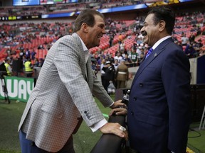 Baltimore Ravens owner Stephen Bisciotti, left, and Jacksonville Jaguars owner Shahid Khan chat before an NFL football game between the Jaguars and the Ravens at Wembley Stadium in London, Sunday Sept. 24, 2017. (AP Photo/Matt Dunham)