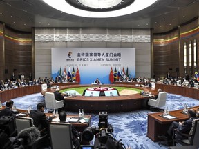 A plenary session of the BRICS Summit is held in Xiamen, Fujian province, China Monday, Sept. 4, 2017. Five major emerging economies opened a summit Monday to map out their future course, with host Chinese President Xi Jinping calling on them to play a bigger role in world governance, reject protectionism and inject new energy into tackling the gap between the world's wealthy and developing nations. (Fred Dufour/Pool Photo via AP)