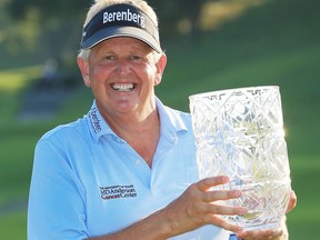 Colin Montgomerie of Scotland poses with the trophy after winning the Japan Airlines Championship, the first PGA Tour Champions event in Japan, on Narita Golf Club's greens in Chiba, near Tokyo, Sunday, Sept. 10, 2017. (Kyodo News via AP)