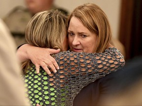 Karen Bobo, mother of Holly Bobo, gives a hug to State prosecutor Jennifer Nicols after giving a victim impact statement during the penalty phase of her daughter's murder trial, Saturday, Sept. 23, in Savannah, Tenn.  Zach Adams, 33, avoided a possible death penalty by agreeing to a sentence of life in prison plus 50 years.   A Hardin County jury convicted Adams on Friday of kidnapping, raping and murdering Holly Bobo in 2011.  (Kenneth Cummings/The Jackson Sun via AP, Pool)