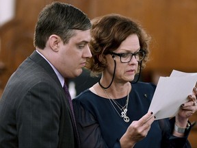 Zachary Adams looks over paperwork with his attorney Jennifer Thompson, during court recess for lunch during day two of the Holly Bobo murder trial, Tuesday, Sept. 12, 2017, in Savannah, Tenn. Adams is charged with felony first-degree murder, especially aggravated kidnapping, aggravated rape of Holly Bobo. He has pleaded not guilty. Bobo disappeared in April 2011. Her remains were found in 2014.  (Kenneth Cummings/The Jackson Sun via AP, Pool)