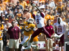 Massachusetts cornerback Isaiah Rodgers (9) nearly intercepts a pass intended for Tennessee wide receiver Josh Palmer (5) during an NCAA college football game, Saturday, Sept. 23, 2017, in Knoxville, Tenn. (Clavin Mattheis/Knoxville News Sentinel via AP)