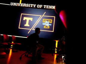 A member of the media attends a press conference during a press conference Thursday, Sept. 14, 2017, in Knoxville, Tenn. Tennessee athletic director John Currie  said athletes for all women's sports at the school can refer to themselves as the Lady Volunteers, changing a decision his predecessor made three years ago.  (Calvin Mattheis/Knoxville News Sentinel via AP)