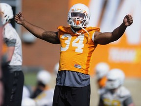 FILE - In this March 23, 2017 file photo, Tennessee linebacker Darrin Kirkland Jr. stretches during a spring football practice in Knoxville, Tenn. Kirkland has a knee injury that will sideline him for the start of the season. (Calvin Mattheis/Knoxville News Sentinel via AP, File)