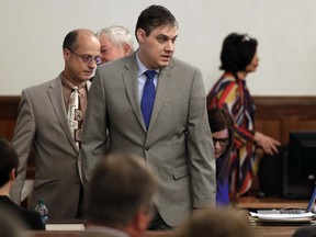 Zachary Adams, right, enters the courtroom for his trial in the kidnapping, rape and murder of nursing student Holly Bobo on Monday, Sept. 11, 2017, in Savannah, Tenn. Bobo, 20, disappeared from her home in Parsons, Tenn. on April 13, 2011. Her remains were found by hunters in September 2014. (AP Photo/Mark Humphrey, Pool)