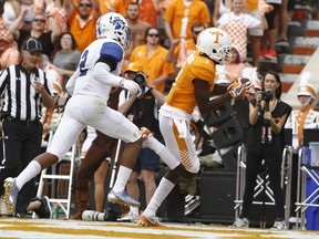 Tennessee wide receiver Brandon Johnson (7) catches a touchdown pass in front of Indiana State safety Lonnie Walker II (2) in the first half of an NCAA college football game, Saturday, Sept. 9, 2017, in Knoxville, Tenn. (AP Photo/Wade Payne)
