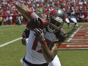 Tampa Bay Buccaneers wide receiver Mike Evans (13) catches a touchdown pass, against the Chicago Bears, Sunday, Sept. 17, 2017, in Tampa, Fla. (AP Photo/Jason Behnken)
