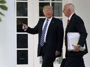 President Donald Trump walks with aide Keith Schiller to the Oval Office of the White House in Washington, Tuesday, May 2, 2017