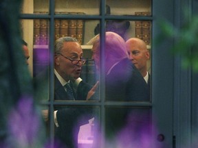 Senate Minority Leader Chuck Schumer (D-NY) makes a point to President Donald Trump in the Oval Office on September 6, 2017 .