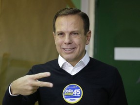 FILE - In this Oct. 2, 2016 file photo, Joao Doria, mayoral candidate with the Brazilian Social Democracy Party gestures after voting in the municipal election in Sao Paulo, Brazil. Doria appears to be positioning himself as a presidential hopeful who can save Brazil from a seemingly bottomless pit of graft scandals, even while insisting he isn't running. (AP Photo/Nelson Antoine, File)