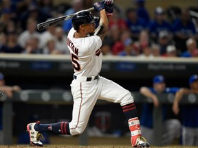 Byron Buxton of the Minnesota Twins follows through on his 10th-inning, game winning homerun against the Toronto Blue Jays Thursday night in Minnesota. The walk-off homer gave the Twins a 3-2 victory.