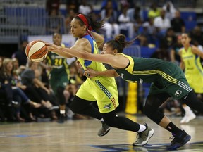 FILE - In this July 1, 2017, file photo, Dallas Wings guard Allisha Gray (15), rear left,  gets a loose ball against Seattle Storm forward Alysha Clark during the second half of a WNBA basketball game in Arlington, Texas. Dallas Wings guard Allisha Gray is the WNBA Rookie of the Year. The league announced Tuesday, Sept. 19, 2017, that Gray received 30 votes from a national media panel while Atlanta Dream guard Brittney Sykes got 10.  (Jae S. Lee/The Dallas Morning News via AP, File)