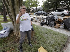 Barron Lazano talks about surviving and damage caused to her home in the aftermath of Harvey Wednesday, Aug. 30, 2017, in Houston. Harvey did not discriminate in its destruction. It raged through neighborhoods rich and poor, black and white, upscale and working class. Across Houston and surrounding communities, no group sidestepped its paralyzing deluges and apocalyptic floods.(AP Photo/David J. Phillip)