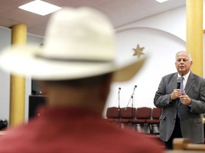 In this Monday, Aug. 21, 2017, photo, Rep. Gene Green, D-Texas, speaks during a town hall meeting with constituents in Houston. Houston is America's largest Hispanic city without a Hispanic member of the U.S. House. Green has endured by winning over Houston's top Hispanic activists, and obsessing about keeping constituents happy: organizing immunization and U.S. citizenship drives and, after Hurricane Harvey, helping residents talk directly to federal relief officials. (AP Photo/David J. Phillip)