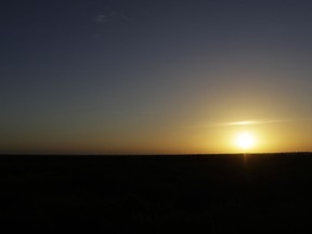 In this Aug. 11, 2017, photo, the sun sets over the Santa Ana National Wildlife Refuge, home to 400-plus species of birds and several endangered wildcats, in Alamo, Texas. The U.S. government carefully designed a path of least resistance to building a border wall in Texas, picking the wildlife refuge and other places it already owns or controls to quickly begin construction. All it needed was Congress to approve the money. (AP Photo/Eric Gay)