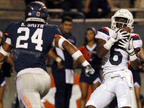 Arizona's Shun Brown pulls in a pass from quarterback Brandon Dawkins to score a touchdown in the first quarter as UTEP's Kahani Smith defends during an NCAA college football game Friday, Sept. 15, 2017, in El Paso, Texas. (Ruben R. Ramirez/The El Paso Times via AP)