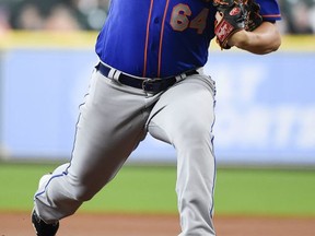 New York Mets starting pitcher Chris Flexen delivers during the first inning of a baseball game against the Houston Astros, Sunday, Sept. 3, 2017, in Houston. (AP Photo/Eric Christian Smith)