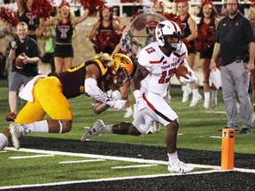 Texas Tech's Cameron Batson scores a first-half touchdown while chased by Arizona State's Dasmond Tautalatasi during the first half of an NCAA college football game Saturday, Sept. 16, 2017, in Lubbock, Texas. (Mark Rogers/Lubbock Avalanche-Journal via AP)