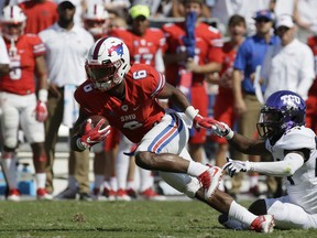 SMU running back Braeden West (6) breaks away from TCU cornerback Julius Lewis (24) during the first half an NCAA college football game in Fort Worth, Texas, Saturday, Sept. 16, 2017. (AP Photo/LM Otero)