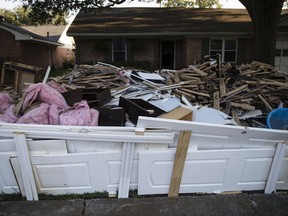 In this Wednesday, Sept. 6, 2017, photo, debris sits in front of a home in the aftermath of Hurricane Harvey in Houston. Harvey's record-setting rains now have the potential to set records for the amount of debris one storm can produce. (AP Photo/Matt Rourke)