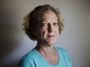 Julie Boon, director of Eudaimonia Recovery Homes poses for a photograph at one of her facility damaged by Hurricane Harvey on Friday, Sept. 8, 2017, in Houston. In the aftermath of flooded Houston, Julie Boon oversaw repairs at a sober-living home while giving advice to residents based on her own 30 years of sobriety. (AP Photo/Matt Rourke)