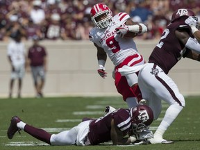 Louisiana-Lafayette running back Trey Ragas (9) is tackled by Texas A&M defensive back Larry Pryor (11) during the first quarter of an NCAA college football game Saturday, Sept. 16, 2017, in College Station, Texas. (AP Photo/Sam Craft)