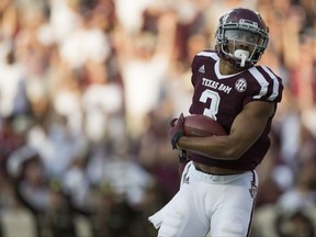 Texas A&M wide receiver Christian Kirk (3) turns into the end zone after catching a pass for a touchdown against Nicholls State during the first quarter of an NCAA college football game Saturday, Sept. 9, 2017, in College Station, Texas. (AP Photo/Sam Craft)