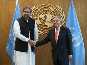 Prime Minister of Pakistan Shahid Khaqan Abbasi, left, is greeted by United Nations Secretary-General Antonio Guterres before a meeting Thursday, Sept. 21, 2017, at U.N. headquarters. (AP Photo/Craig Ruttle)