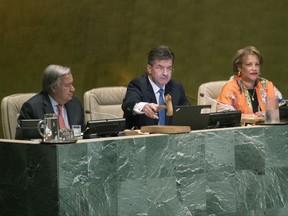 United Nations General Assembly President Miroslav Lajcak, center, is joined by Secretary-General Antonio Guterres, left, as he the opens the 72nd regular session of the UN General Assembly Tuesday, Sept. 12, 2017, at United Nations headquarters. (AP Photo/Mary Altaffer)