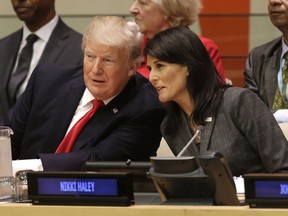 United States President Donald Trump speaks with U.S. Ambassador to the United Nations Nikki Haley before a meeting during the United Nations General Assembly at U.N. headquarters, Monday, Sept. 18, 2017. (AP Photo/Seth Wenig)