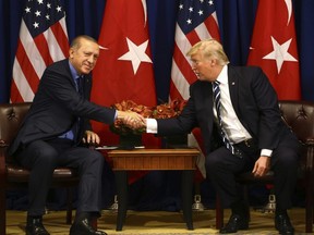 Turkey's President Recep Tayyip Erdogan and U.S. President Donald Trump shake hands prior to their meeting in New York, Thursday, Sept. 21, 2017. Erdogan is in New York for the United Nations General Assembly.