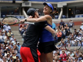 Martina Hingis, of Switzerland, right, celebrates with Jamie Murray, of Great Britain, after winning the mixed doubles final of the U.S. Open tennis tournament against Chan Has-Ching, of Taiwan, and Michael Venus, of New Zealand, Saturday, Sept. 9, 2017, in New York. (AP Photo/Julie Jacobson)