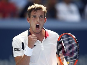 Pablo Carreno Busta, of Spain, reacts after scoring a point against Diego Schwartzman, of Argentina, during the quarterfinals of the U.S. Open tennis tournament, Tuesday, Sept. 5, 2017, in New York. (AP Photo/Jason Decrow)