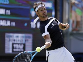 Fabio Fognini, of Italy, returns a shot from Stefano Travaglia, of Italy, during the first round of the U.S. Open tennis tournament, Wednesday, Aug. 30, 2017, in New York.