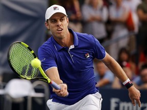 Sam Querrey, of the United States, returns a shot from Dudi Sela, of Israel, during the second round of the U.S. Open tennis tournament, Wednesday, Aug. 30, 2017, in New York. (AP Photo/Andres Kudacki)