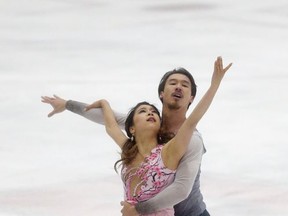 Japan's Kana Muramoto, left, and Chris Reed compete during the free dance program at the U.S. International Figure Skating Classic in Salt Lake City, Saturday, Sept. 16, 2017. (AP Photo/Rick Bowmer)