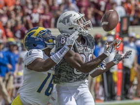 Virginia Tech wide receiver James Clark (89) tries to haul in a pass against Delaware's Nijuel Hill (16) during the first half of an NCAA college football game, Saturday, Sept. 9, 2017, at Lane Stadium in Blacksburg, Va. (AP Photo/Don Petersen)