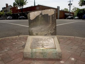 This photo taken May 5, 2005, shows the historic pre-civil war auction block for slaves and property at the corner of Charles and William Streets in downtown Fredericksburg, Va. The NAACP's Fredericksburg branch is calling for the block to be replaced by a historical panel. Discussions about moving the block began after last month's deadly violence in Charlottesville, Va.  (Reza A Marvashti /The Free Lance-Star via AP)