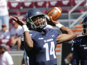 Old Dominion quarterback Steven Williams (14) warms up prior to the start of an NCAA college football game against Virginia Tech in Blacksburg, Va., Saturday, Sept. 23, 2017. (AP Photo/Steve Helber)
