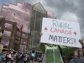 Protesters gather at Canada Place on May 25, 2017 to rally on behalf of the 300 workers at the Case Processing Centre in Vegreville whose jobs the federal government plans to move to Edmonton.