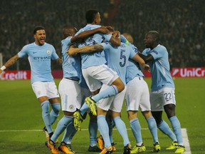 Manchester City's John Stones, third right, jubilates with teammates after scoring the games first goal during a Champions League Group F soccer match between Feyenoord and Manchester City at the Kuip stadium in Rotterdam, Netherlands, Wednesday, Sept. 13, 2017. (AP Photo/Peter Dejong)