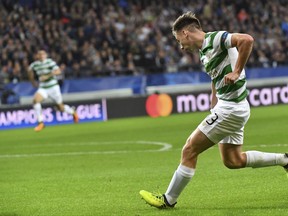 Celtic's Kieran Tierney, right, crosses the ball to Celtic's Leigh Griffiths to score the match first goal during a Champions League Group B soccer match between Anderlecht and Celtic at the Constant Vanden Stock stadium in Brussels, Wednesday, Sept. 27, 2017. (AP Photo/Geert Vanden Wijngaert)