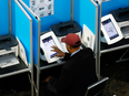 A voter in Denver, Colorado, fills out an electronic ballot. Colorado was one of 21 states targeted by hackers during the 2016 U.S. presidential election.