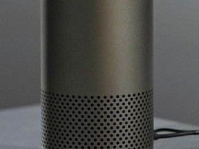 A new Amazon Echo is displayed during a program announcing several new Amazon products by the company, Wednesday, Sept. 27, 2017, in Seattle. Amazon says it is cutting the price of its Echo smart speaker to $100 from $180, improving the sound quality and upgrading its appearance with six new "shells." The next generation speaker, which is powered by Amazon's Alexa voice assistant, will have a dedicated woofer and a tweeter for the first time, as well as Dolby sound. (AP Photo/Elaine Thompson)
