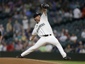 Seattle Mariners starting pitcher Andrew Moore works against the Houston Astros during the first inning of a baseball game Wednesday, Sept. 6, 2017, in Seattle. (AP Photo/John Froschauer)