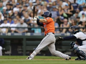 Houston Astros' Alex Bregman hits a two-run double against the Seattle Mariners during the seventh inning of a baseball game, Monday, Sept. 4, 2017, in Seattle. (AP Photo/John Froschauer)
