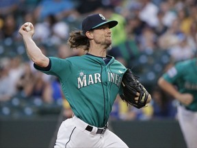 Seattle Mariners starting pitcher Mike Leake throws to the Oakland Athletics during the first inning of a baseball game, Friday, Sept. 1, 2017, in Seattle. (AP Photo/Ted S. Warren)
