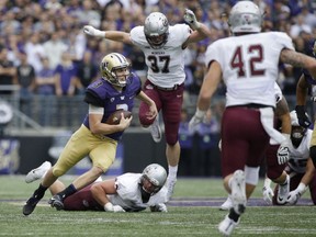 Washington quarterback Jake Browning runs the ball against Montana in the first half of an NCAA college football game, Saturday, Sept. 9, 2017, in Seattle. (AP Photo/Ted S. Warren)